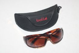 A pair of Bolle sun glasses in case