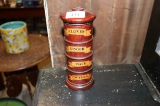 A wooden spice tower