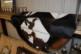 An as new cow hide rug