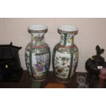 A pair of Canton baluster vases decorated in the t