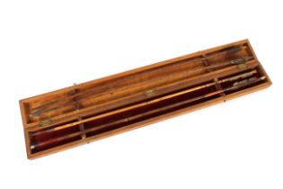 An Indian arrow box containing four arrows