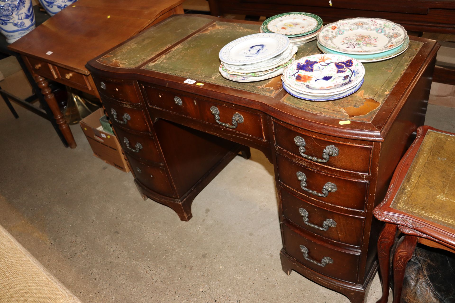 A reproduction mahogany pedestal writing desk