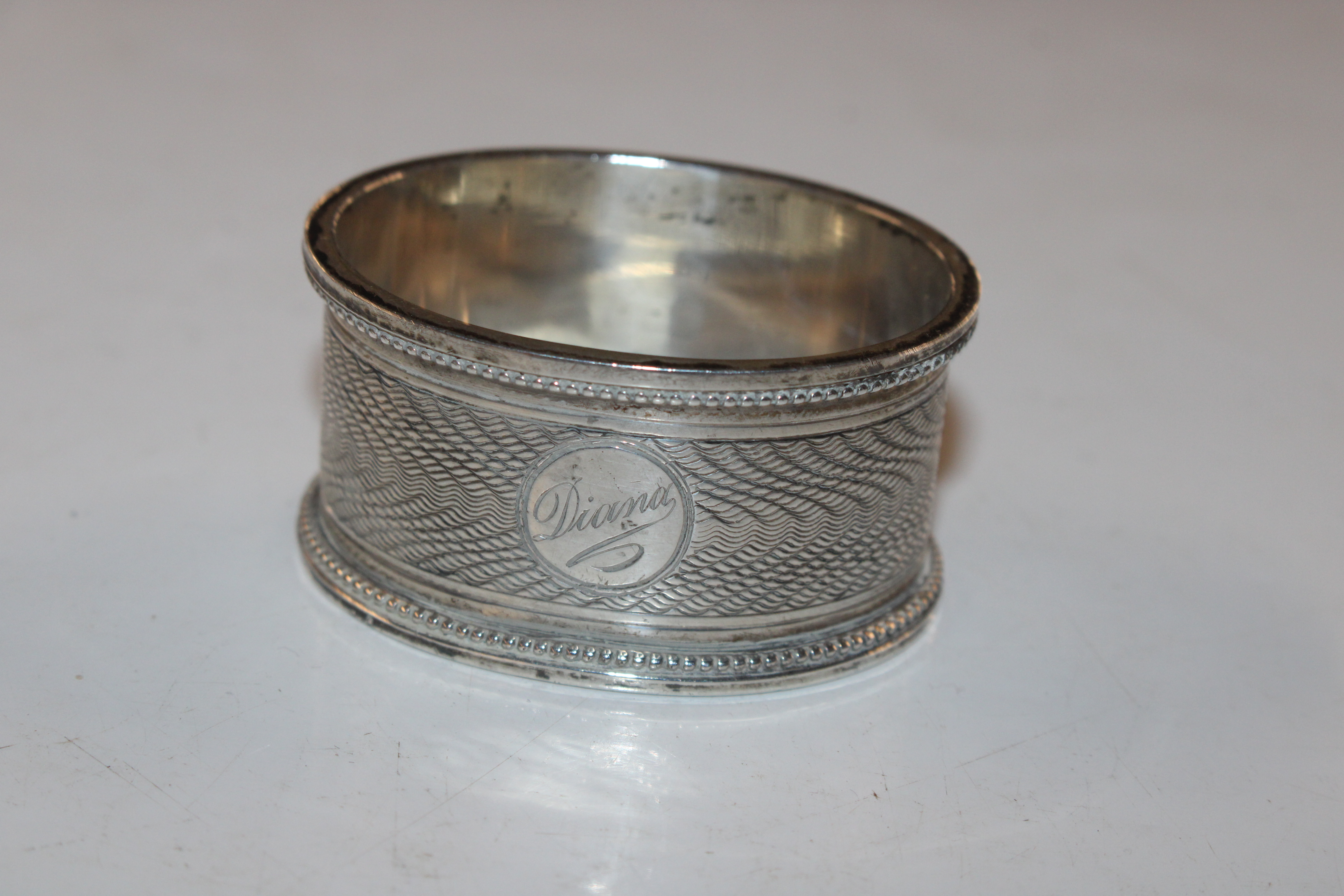 A pair of silver pepperettes; a silver napkin ring - Image 6 of 10