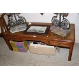 A mahogany and cross banded coffee table fitted tw