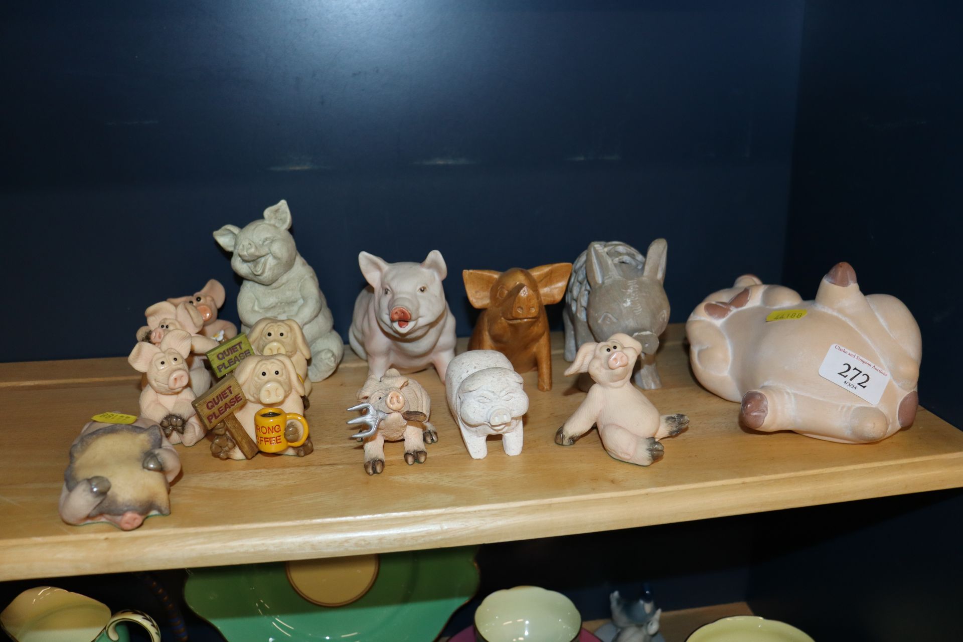A collection of various pig ornaments