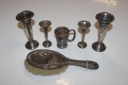 A silver backed dressing table brush; two pairs of