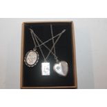 An Adie & Lovekin locket and two others approx. to