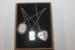 An Adie & Lovekin locket and two others approx. to