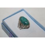 A large Sterling silver and turquoise dress ring,