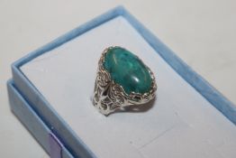 A large Sterling silver and turquoise dress ring,