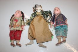 Two Oriental dolls and similar puppet