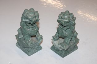 A pair of carved stone temple dogs