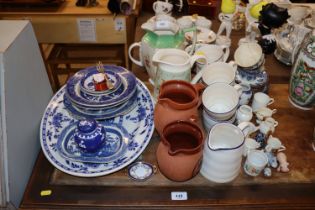 A quantity of John Lewis mugs and jug; various blu