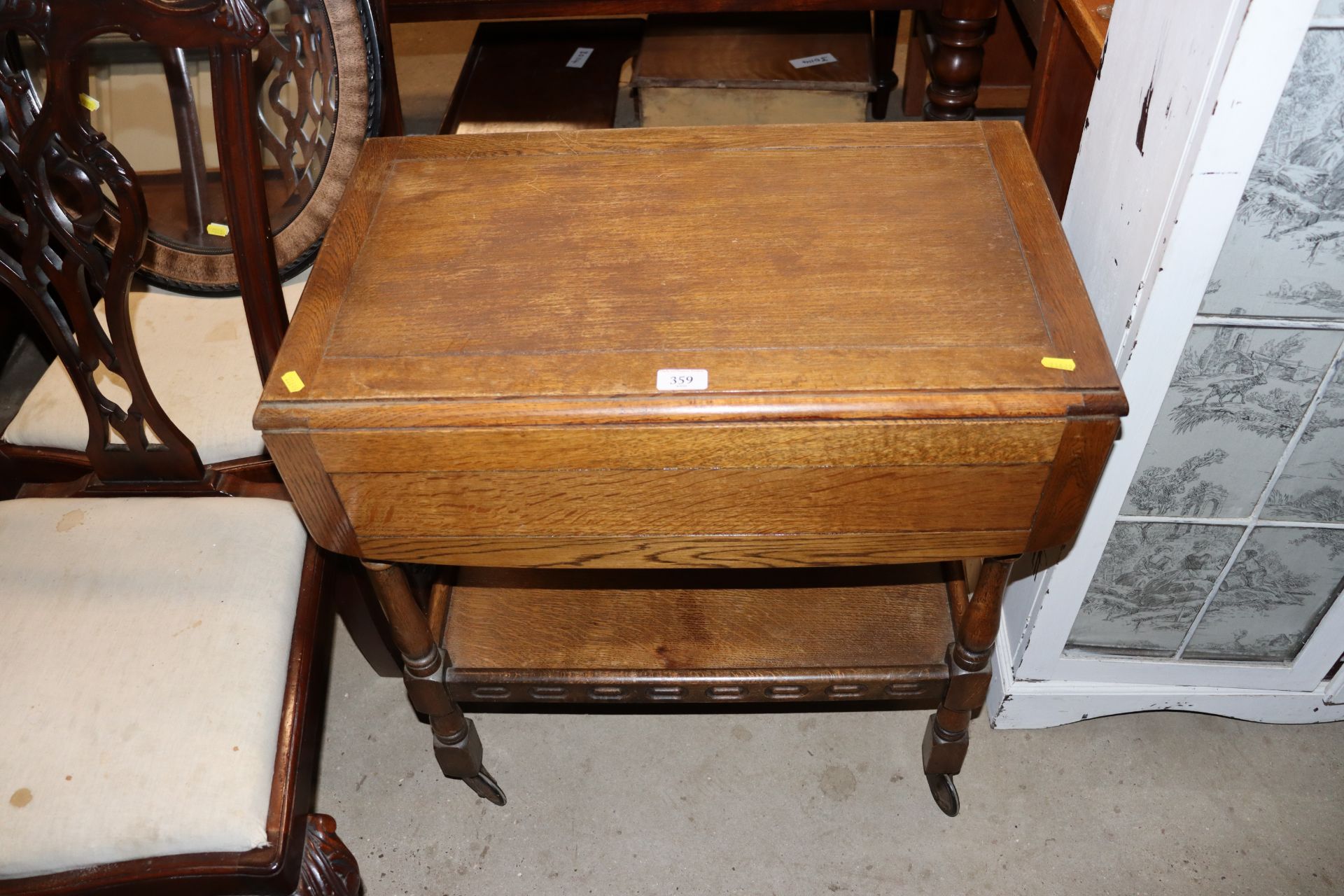 An oak drop leaf tea trolley