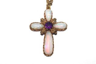 A Crucifix pendant in yellow metal mount set opals