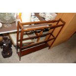 An Edwardian mahogany towel rail