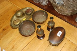 A brass inkwell; a pair of brass bowls; brass vase