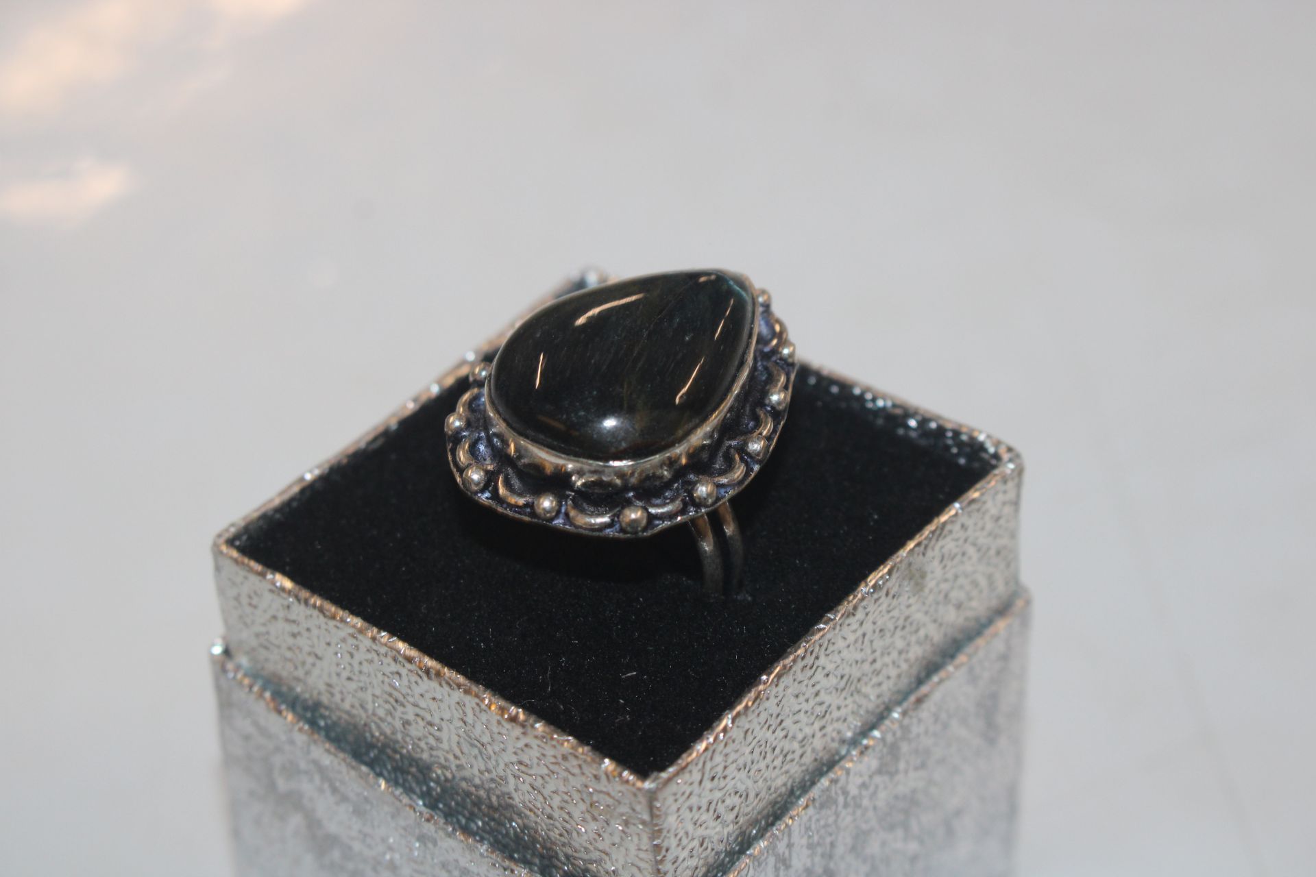 A white metal and labradorite ring