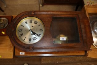 An oak cased eight day wall clock