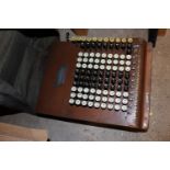 A Comptometer copper early desk calculator