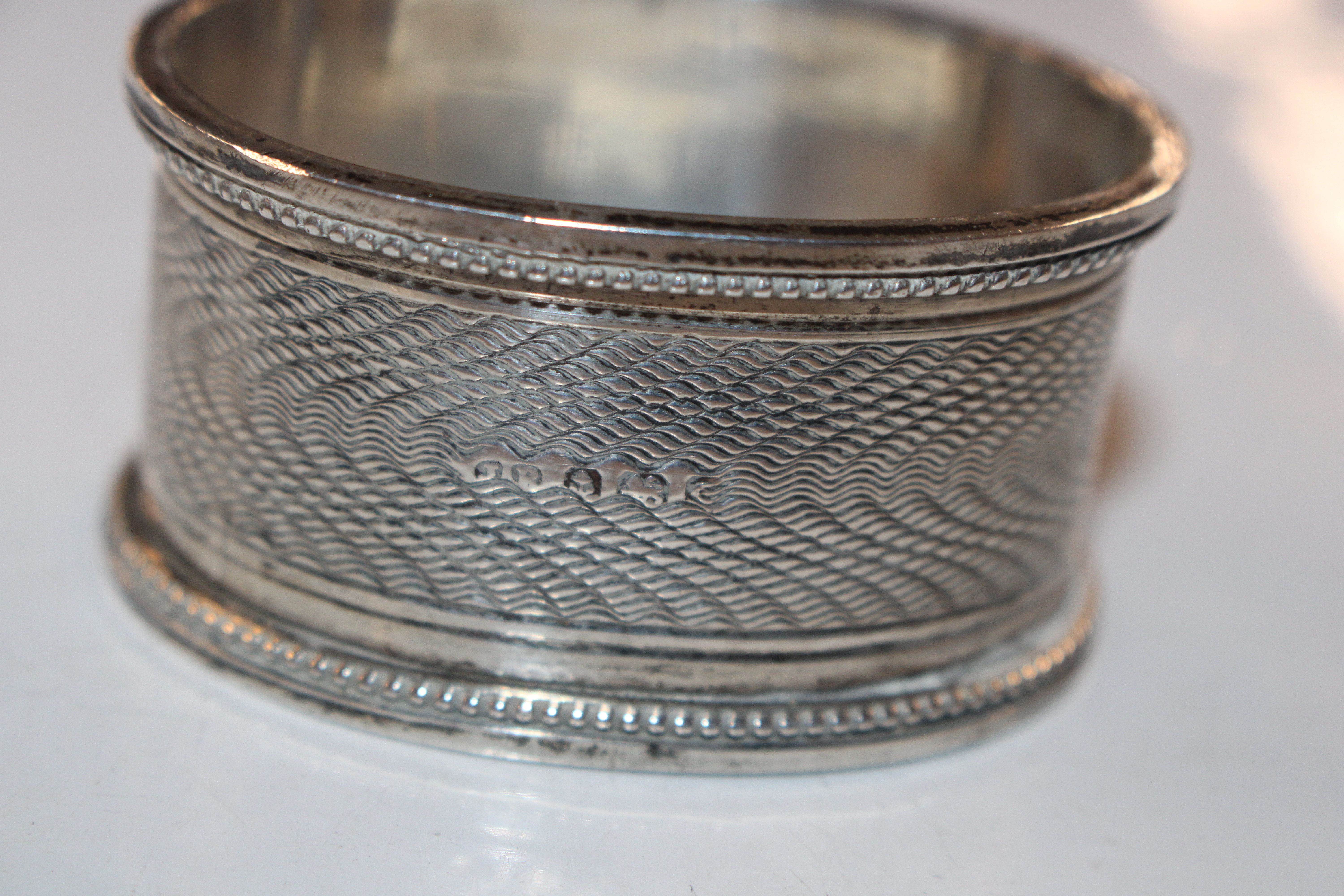 A pair of silver pepperettes; a silver napkin ring - Image 7 of 10