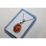 An Art Nouveau style Sterling silver and amber pen