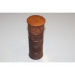 A carved wooden spice tower