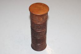 A carved wooden spice tower