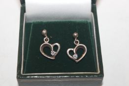 A pair of 925 silver heart shaped ear-rings