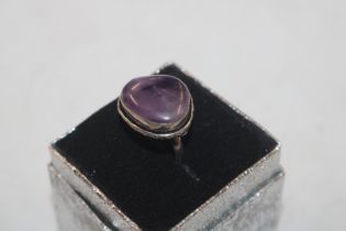 A white metal and amethyst set ring