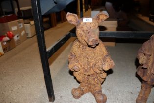 A rusty cast iron model of a pig