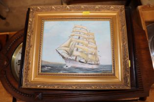 An oil on board depicting a sailing ship, signed G