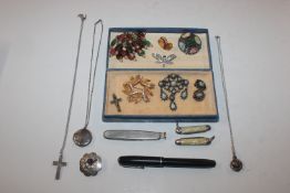 A box of costume jewellery to include brooches, lo