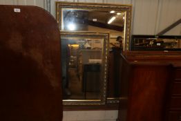 Two gilt framed bevel edged oblong wall mirrors