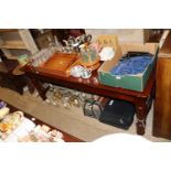 A teak ships table, the three section top raised o