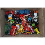 A box of various die-cast and other model vehicles