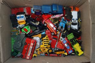 A box of various die-cast and other model vehicles