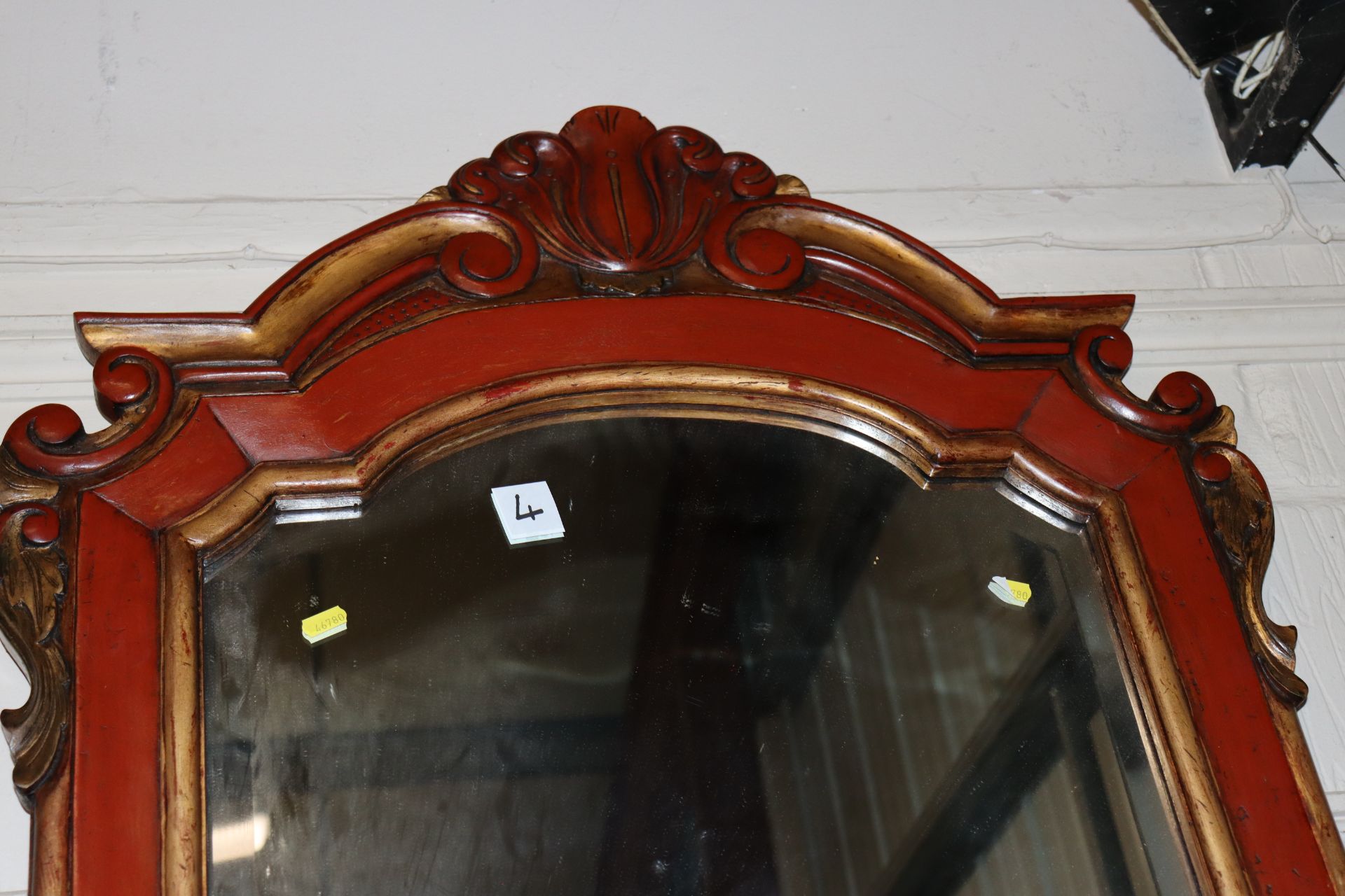 A red painted and gilt bevel edged wall mirror, me - Image 2 of 3