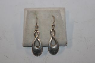 A pair of 1997 Kit heath Sterling silver stylised