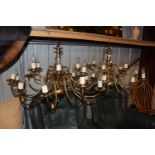 A pair of brass chandeliers