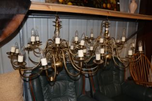 A pair of brass chandeliers