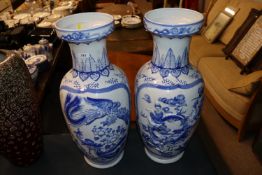 A pair of Oriental decorated baluster vases