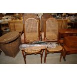 A pair of cane seated and backed bent wood chairs