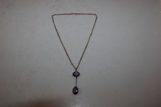 A 9ct gold necklace with amethyst pendant, approx.