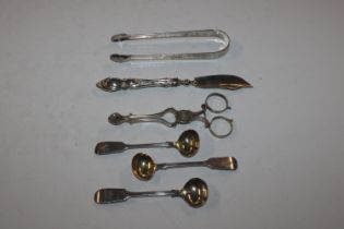 A pair of silver sugar tongs; a pair of silver sug