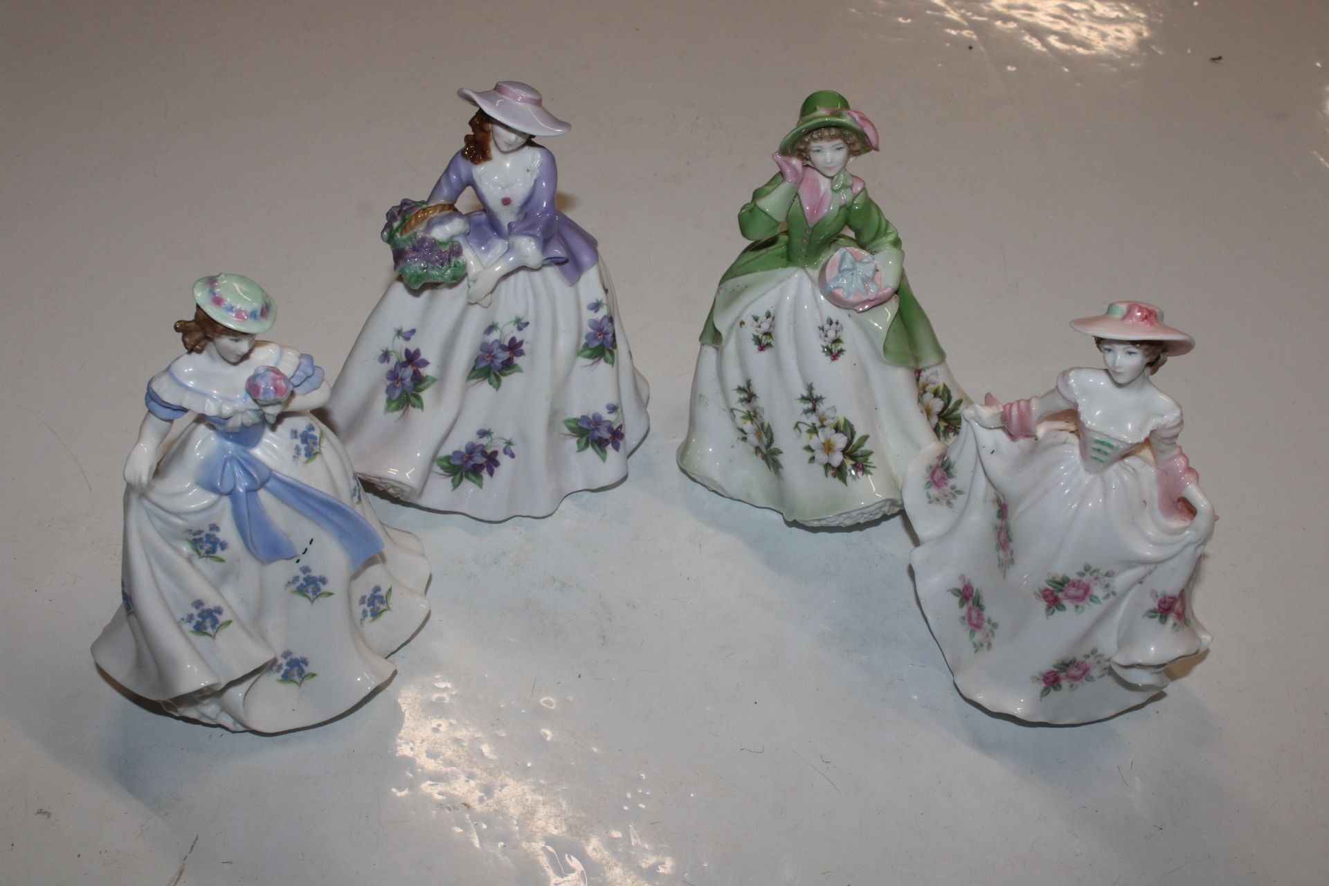Four Royal Worcester figurines