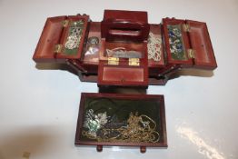 A cantilever jewellery box and contents to include