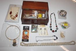 A small mahogany box and contents of various costu