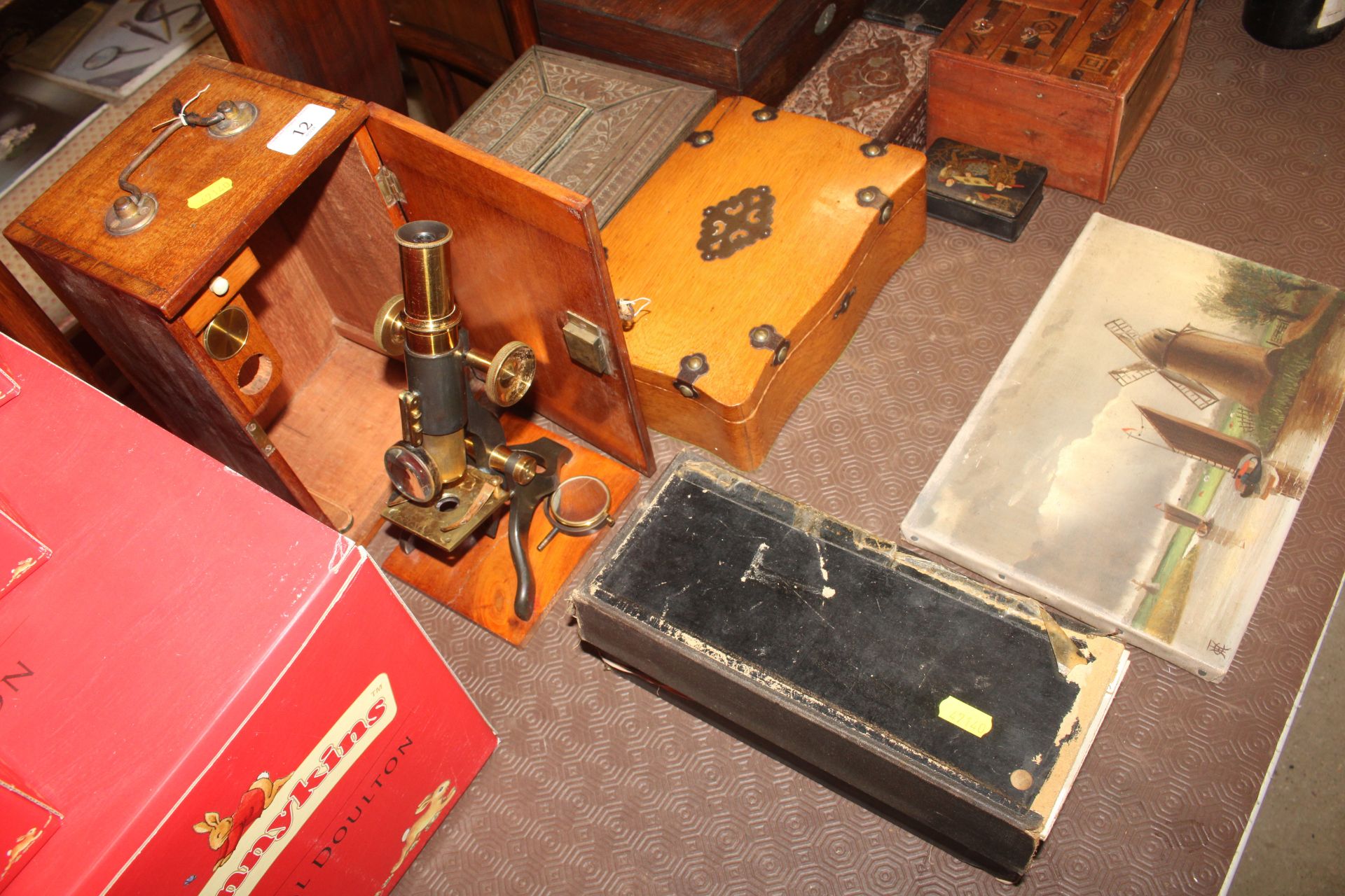 A mahogany cased microscope and a box of miscellan