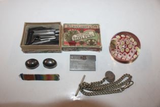 A box containing pen nibs, watch chain and T bar w